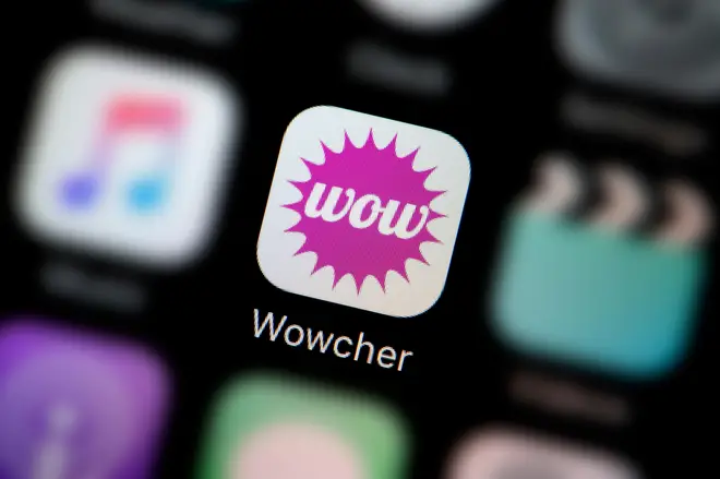A close-up shot of the logo representing the Wowcher app icon, as seen on the screen of a smart phone (Editorial use only)