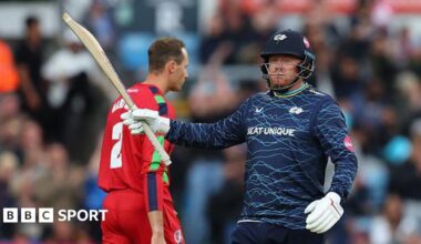 Jonny Bairstow raises his bat after a blistering half-century against Lancashire