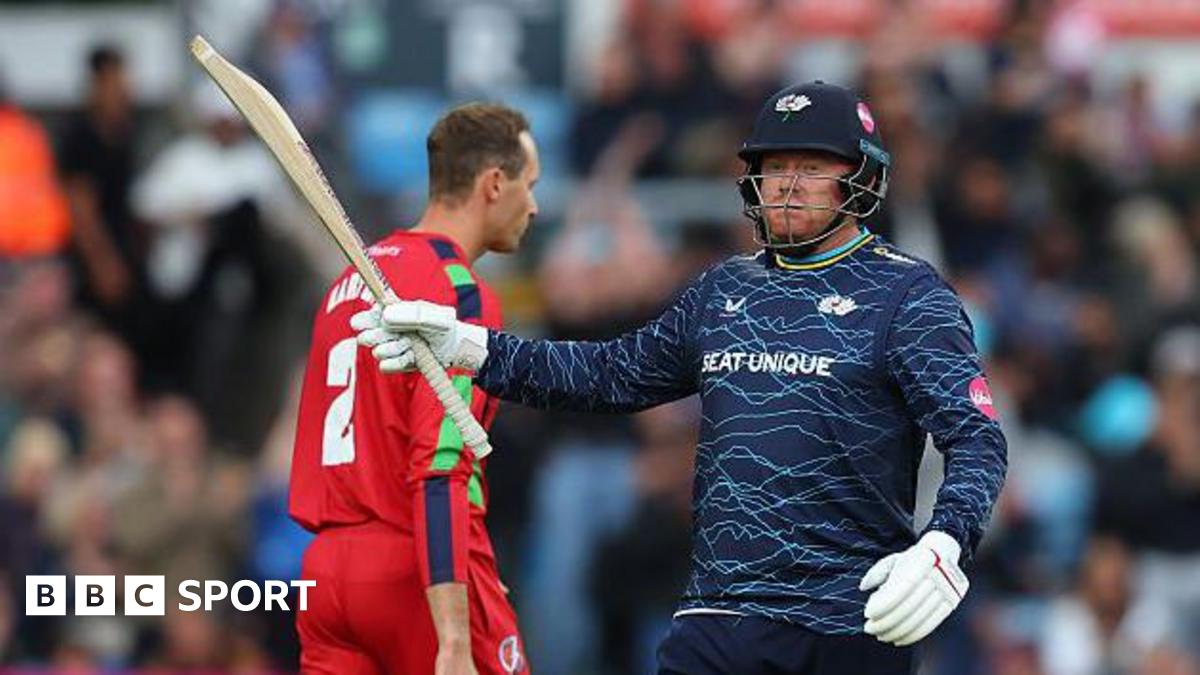 Jonny Bairstow raises his bat after a blistering half-century against Lancashire