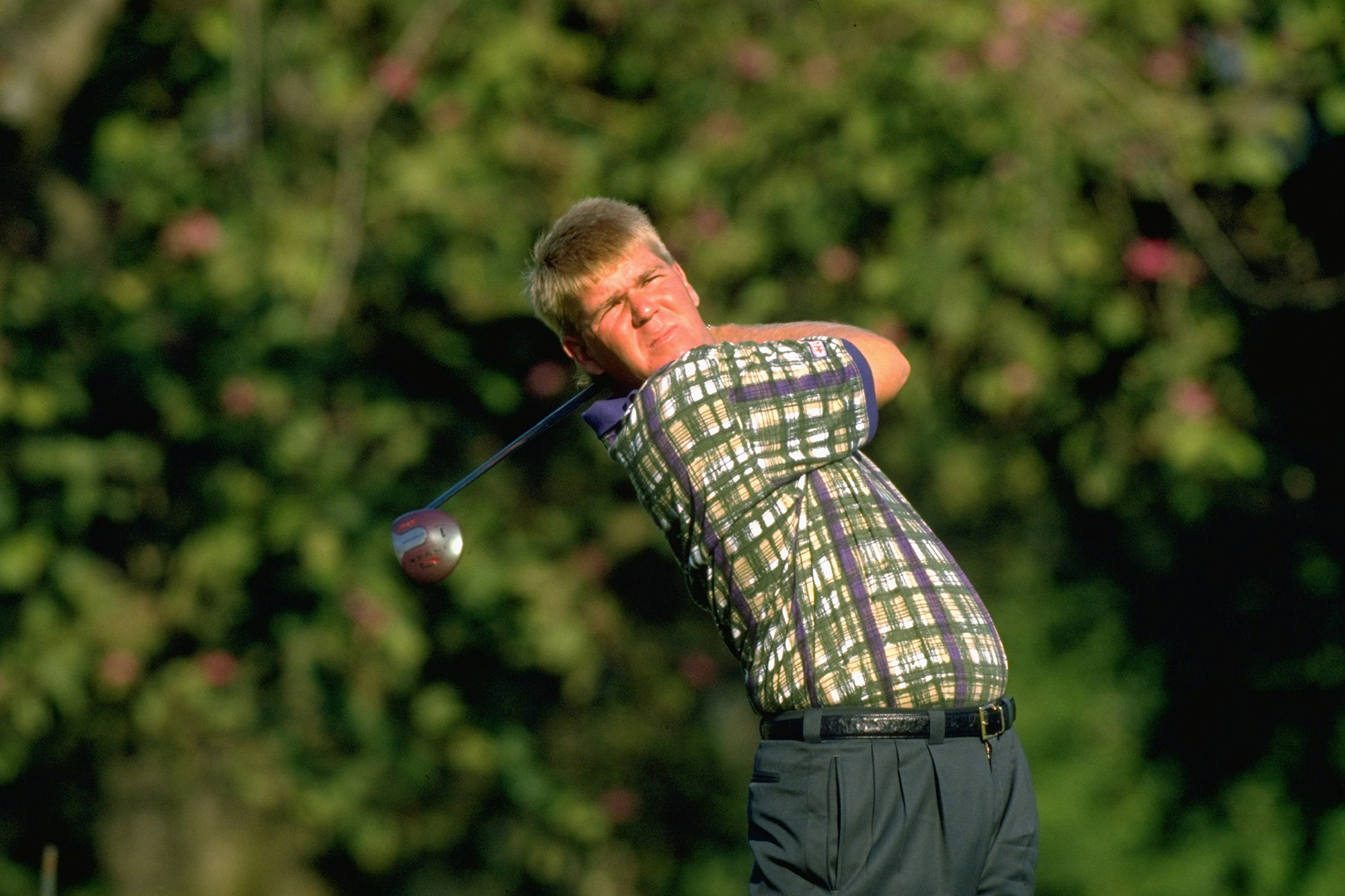 John Daly in the finish position with driver