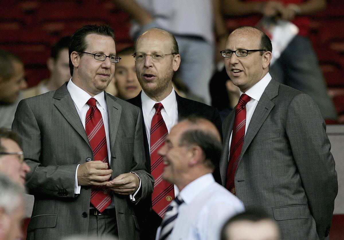 MANCHESTER, ENGLAND-AUGUST 9 : (L to R) Joel Glazer, Avram Glazer and Bryan Glazer, sons of owner Malcolm Glazer, are seen before the Champions League third qualifying round, first leg match between Manchester United and Debreceni VSC at Old Trafford on August 9, 2005 in Manchester, England. (Photo by Clive Brunskill/Getty Images)
