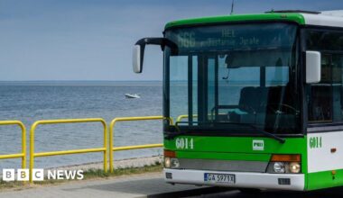 A local bus numbered 666, heading to Polish seaside resort Hel, is parked on the roadside in Rewa, Poland.