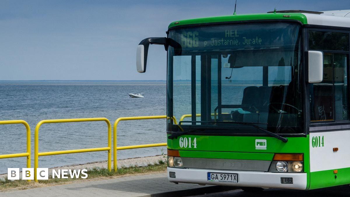 A local bus numbered 666, heading to Polish seaside resort Hel, is parked on the roadside in Rewa, Poland.