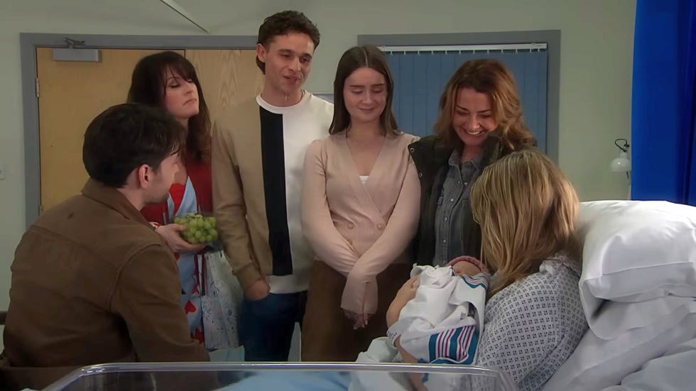Emmerdale, Mack, Kerry, Jacob, Sarah, Moira, Charity, baby Leyla emmerdale, mack, kerry, jacob, sarah, moira, charity, baby leyla in a hospital room, with charity in bed holding the baby