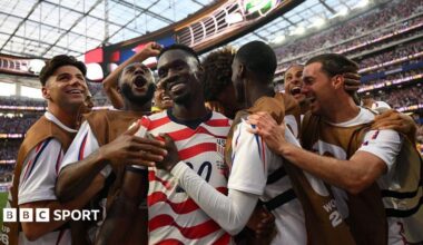 USA players celebrate scoring against Paraguay