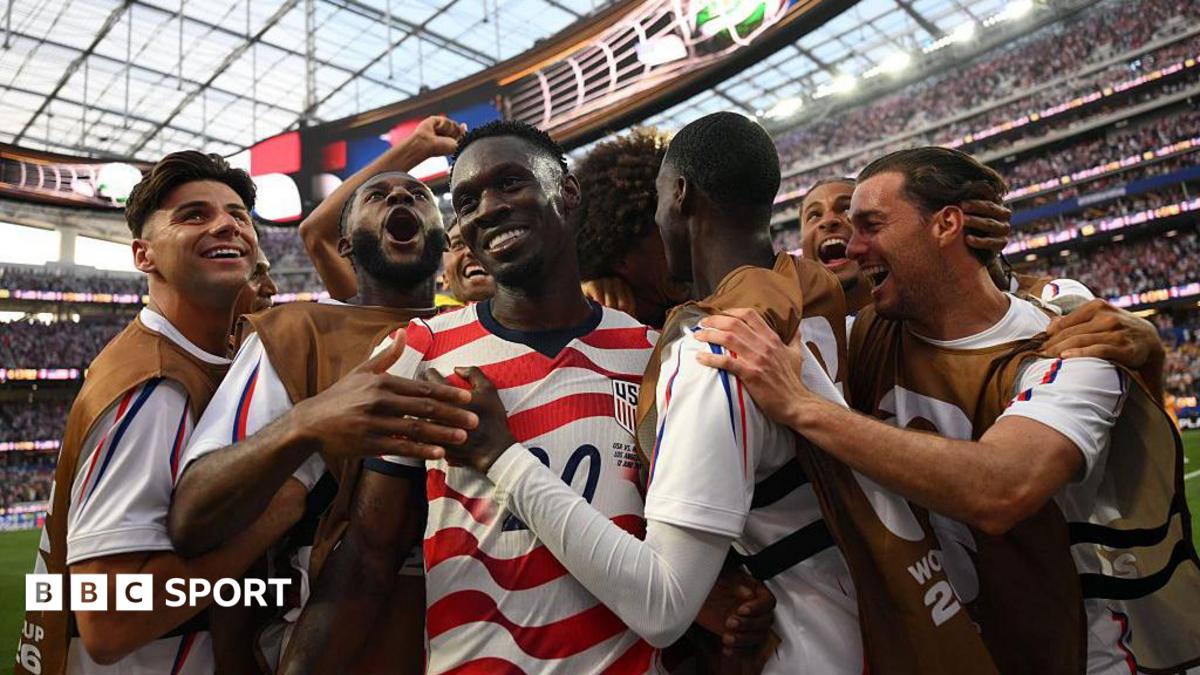 USA players celebrate scoring against Paraguay