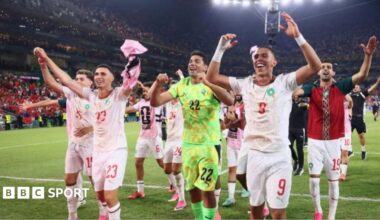 Morocco players celebrate after beating the Netherlands on penalties