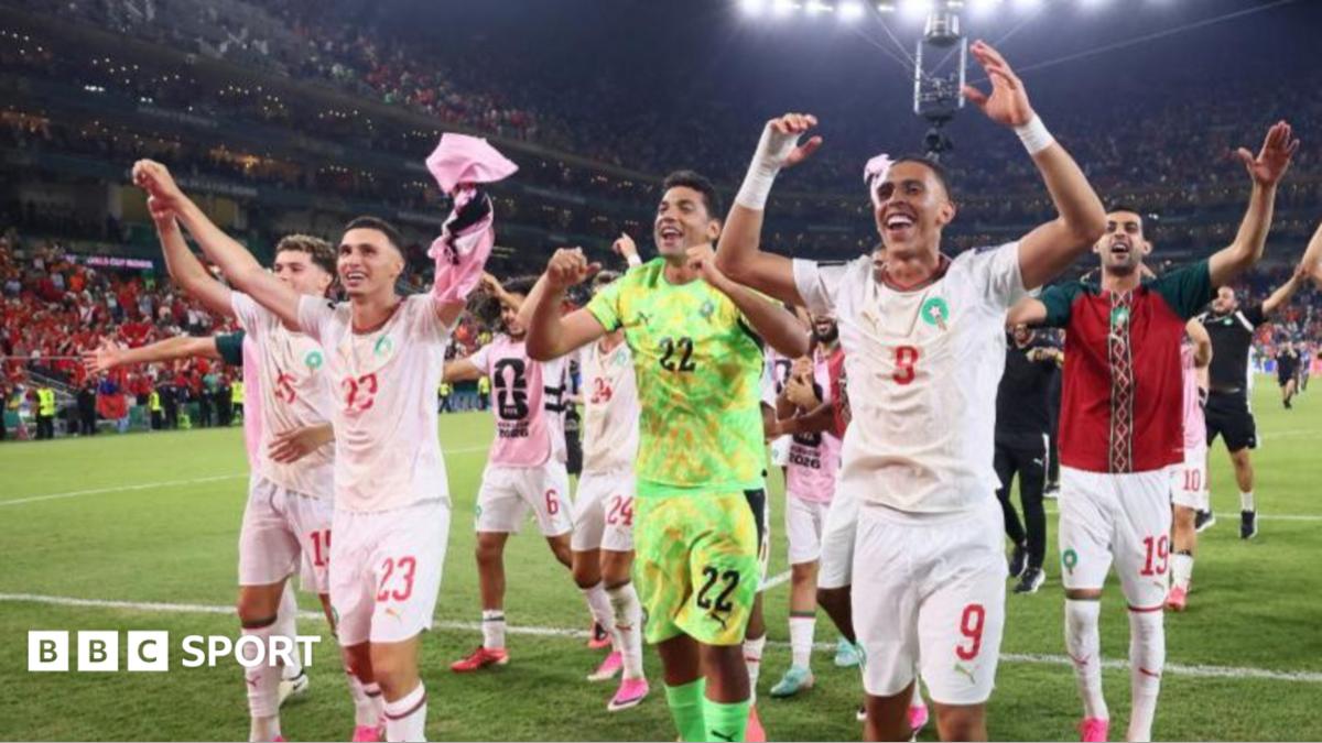 Morocco players celebrate after beating the Netherlands on penalties