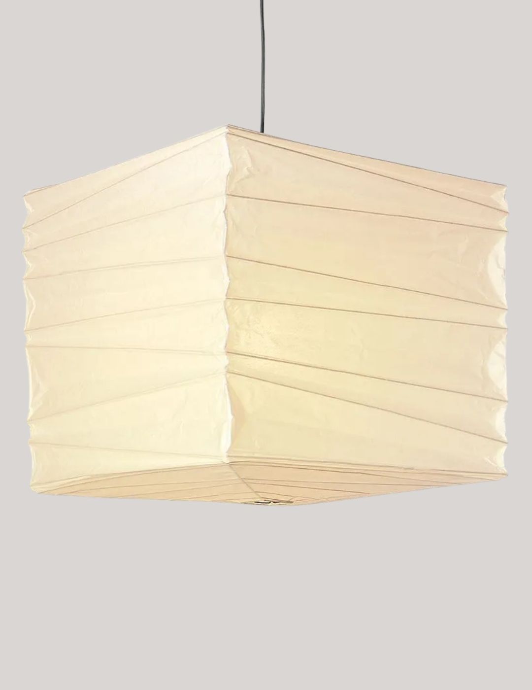 Vitra Akari 45x Pendant Light against pale brown background.