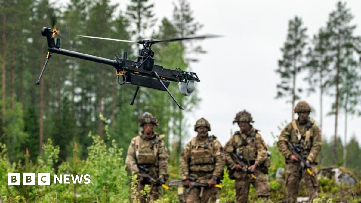 British Army soldiers from 3 Rifles watch a single-rotor helicopter style Ghost drone on exercises in Finland