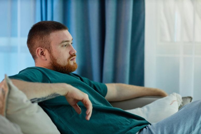 Bored Lazy Man Sitting on Couch