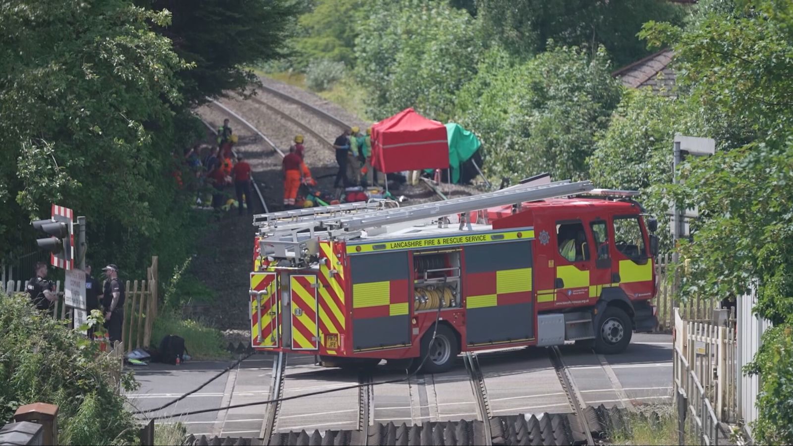 One person dead and child in hospital after train hits car on level crossing near Preston
