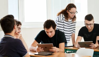 Students using Apple devices in a classroom.