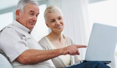 A retired couple review their investing portfolio