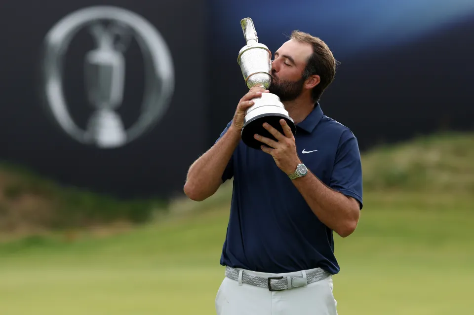 Scottie Scheffler of the United States poses with the Claret Jug on the 18th green after winning The 153rd Open Championship at Royal Portrush Golf Club on July 20, 202