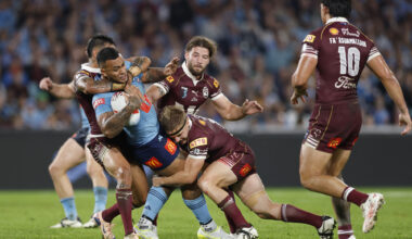 The Blues’ Addin Fonua-Blake is tackled by Maroons players during the first State of Origin game of 2026.