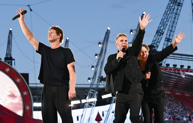 Take That hold up their hands to the crowd at their The Circus Live Stadium Tour