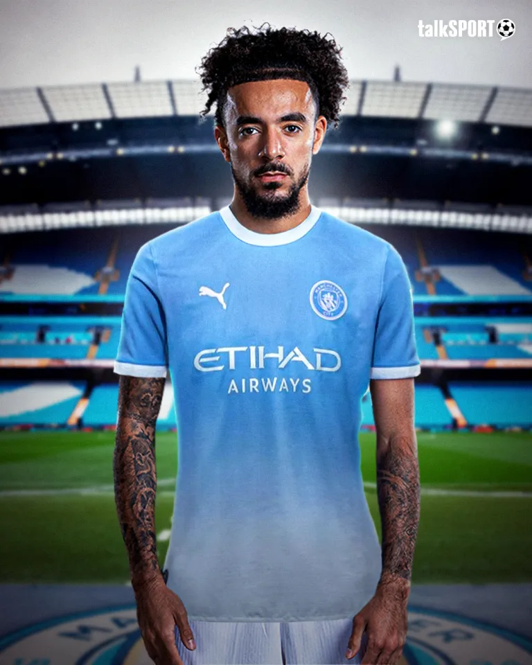 Malo Gusto in a Man City shirt
