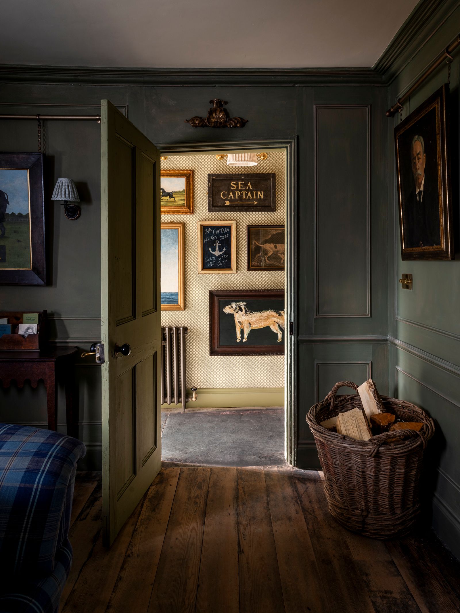 Image may contain Floor Indoors Interior Design Flooring Lamp Art Painting Wood Hardwood Basket and Corner
