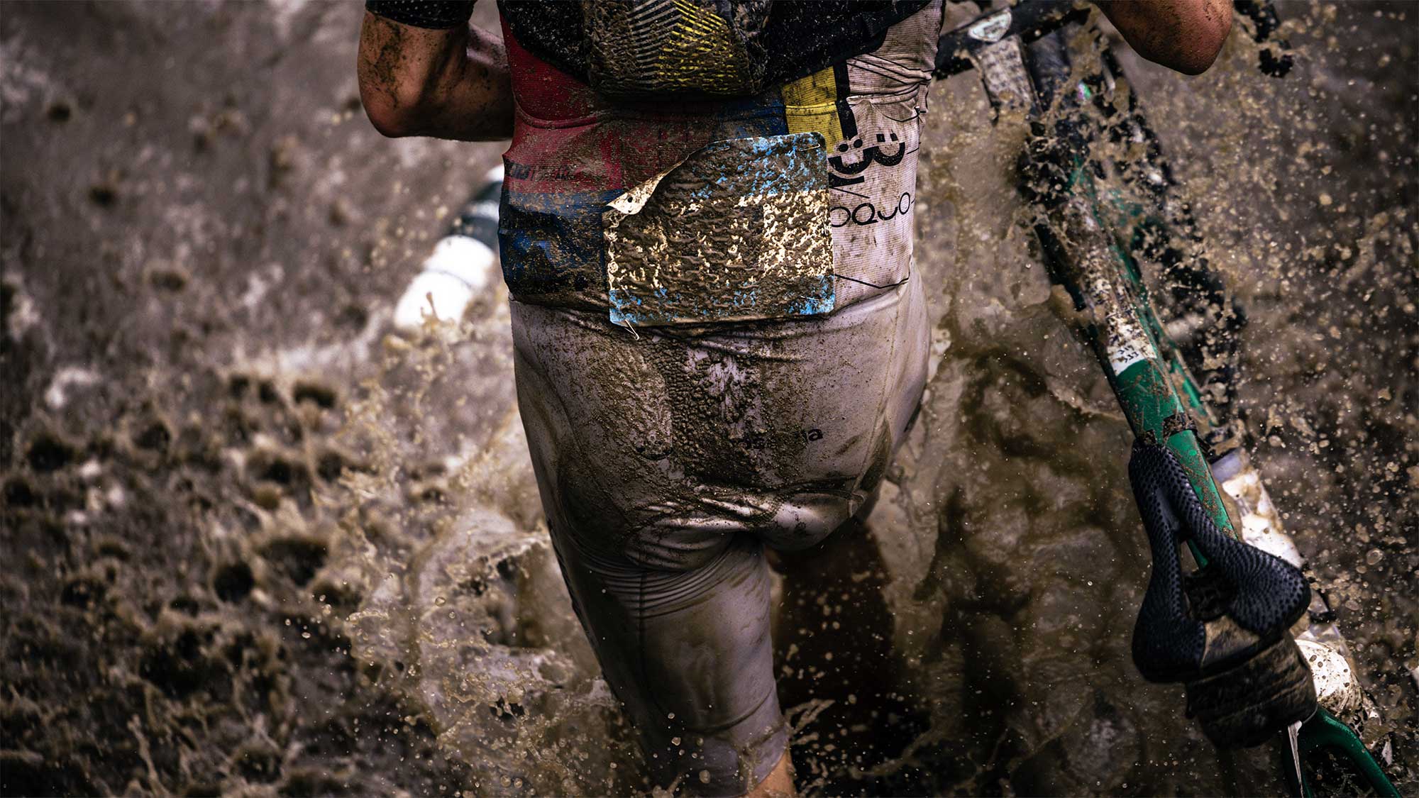 A mud-soaked rider at Unbound 2026