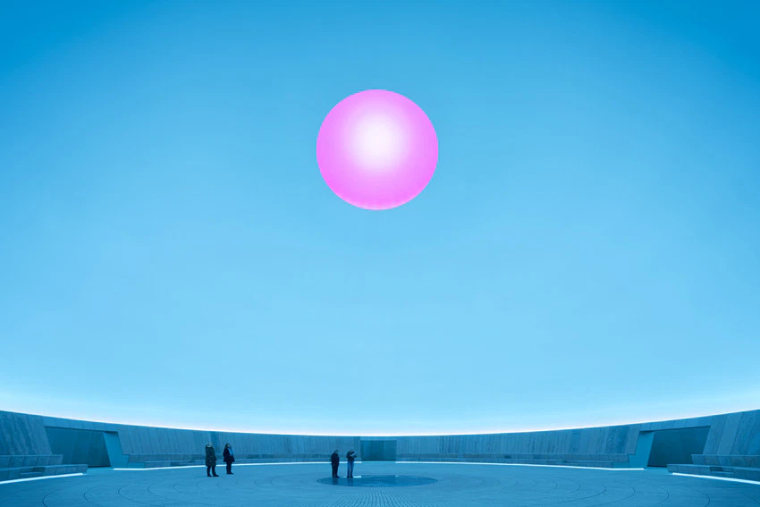 Futuristic blue landscape with people observing a large glowing pink sphere in the sky.