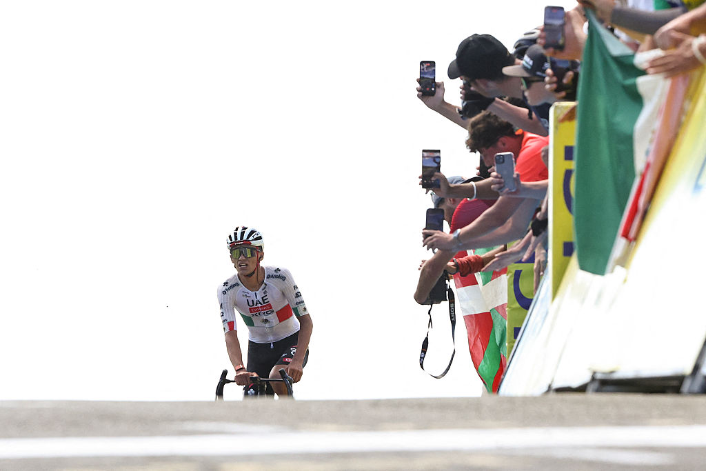 UAE Team Emirates XRG's Mexican rider Isaac Del Toro Romero cycles to the finish line to win the 7th stage of the Tour Auvergne-Rhone-Alpes cycling race (formerly known as the Criterium du Dauphine), 133,6km between La Bridoire and Grand Colombier in the French Alps on June 13, 2026. (Photo by Anne-Christine POUJOULAT / AFP)
