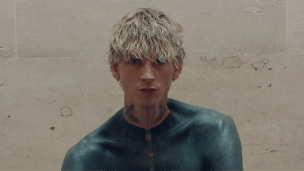 Machine Gun Kelly reveals terrifying side effect of 'dark mode' tattoo which covers his entire upper half