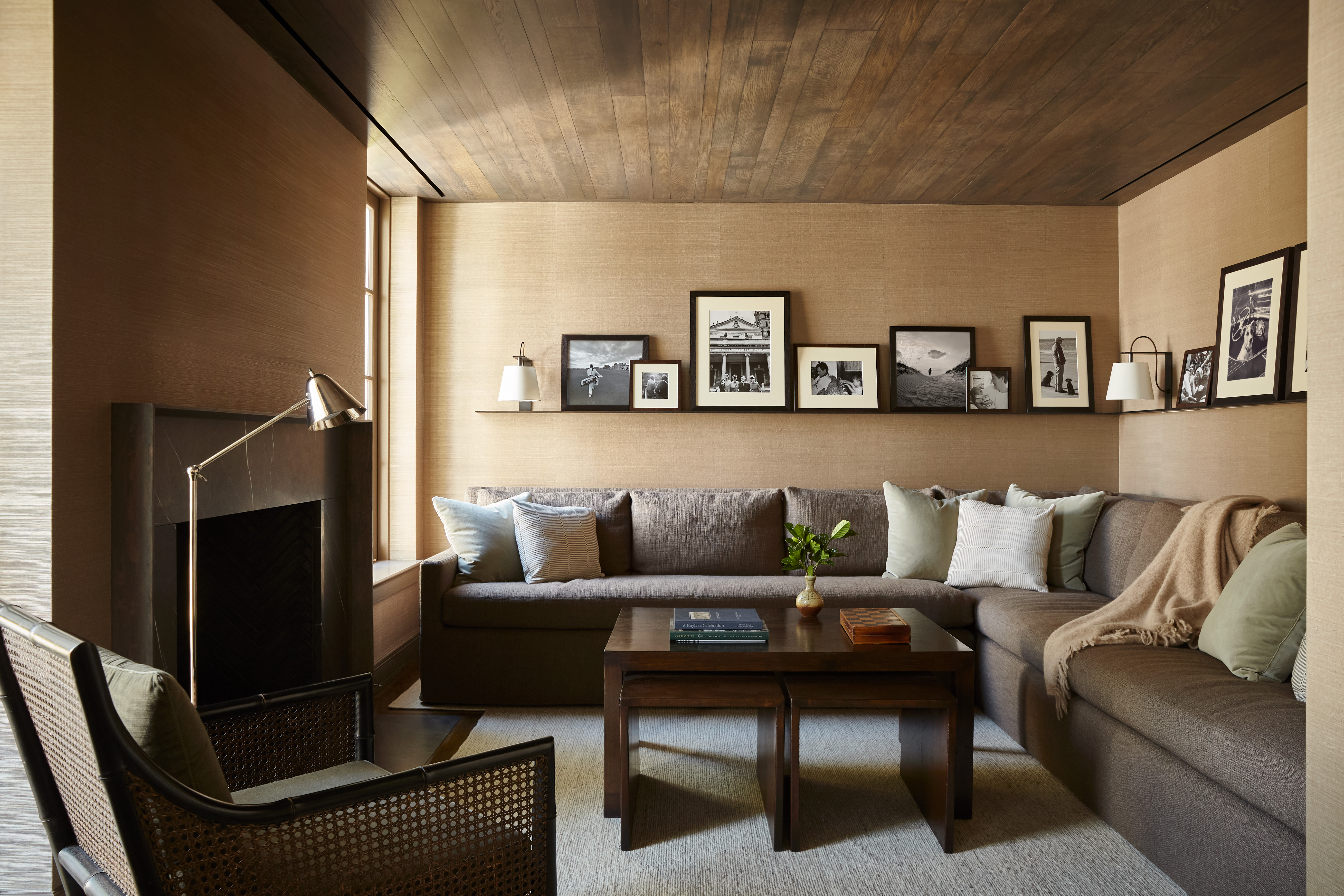 Contemporary living room with photo ledge above corner sofa