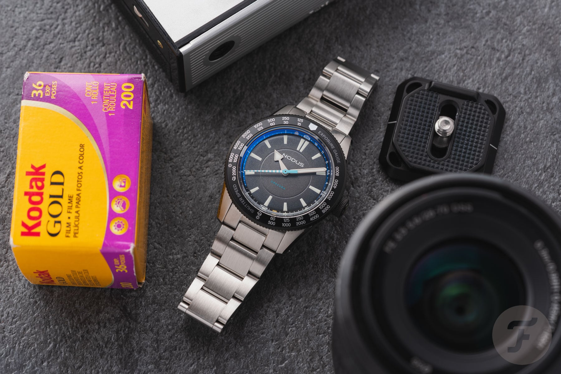 Nodus Obscura II flat-lay with lens and film