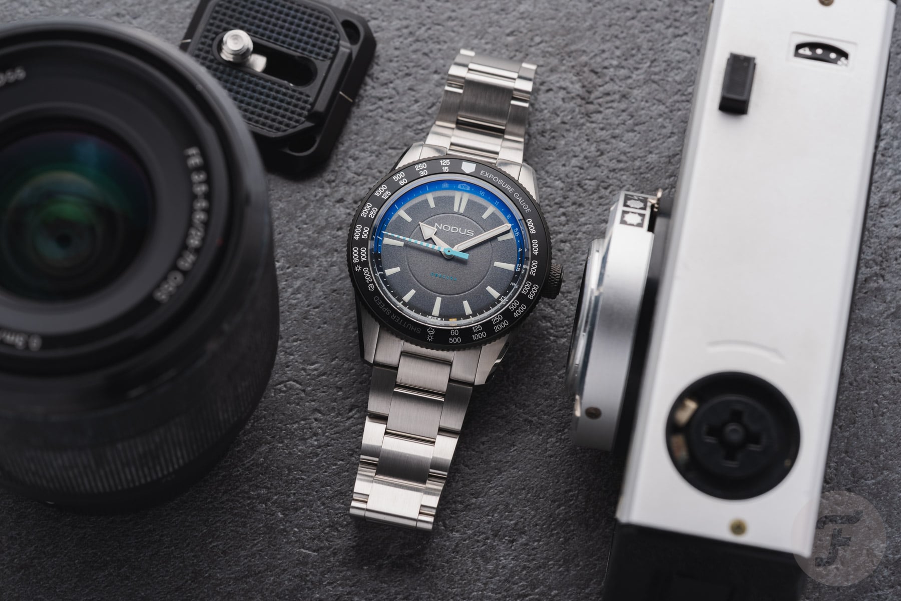 Nodus Obscura II flat-lay with camera and lens