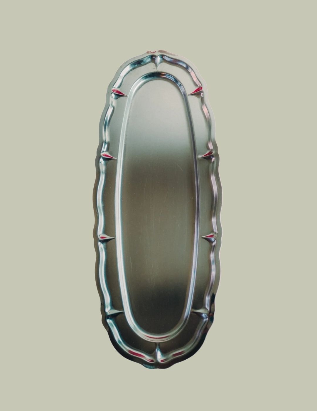 Maison Flaneur Big Oval Platter against pale green background.