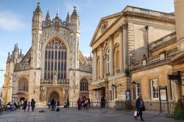 Bath, United Kingdom - November 2, 2017: The Abbey Church of Saint Peter and Saint Paul, Bath, commonly known as Bath Abbey. Ordinary people walk on city square; Shutterstock ID 772794154; Purchase Order: -
