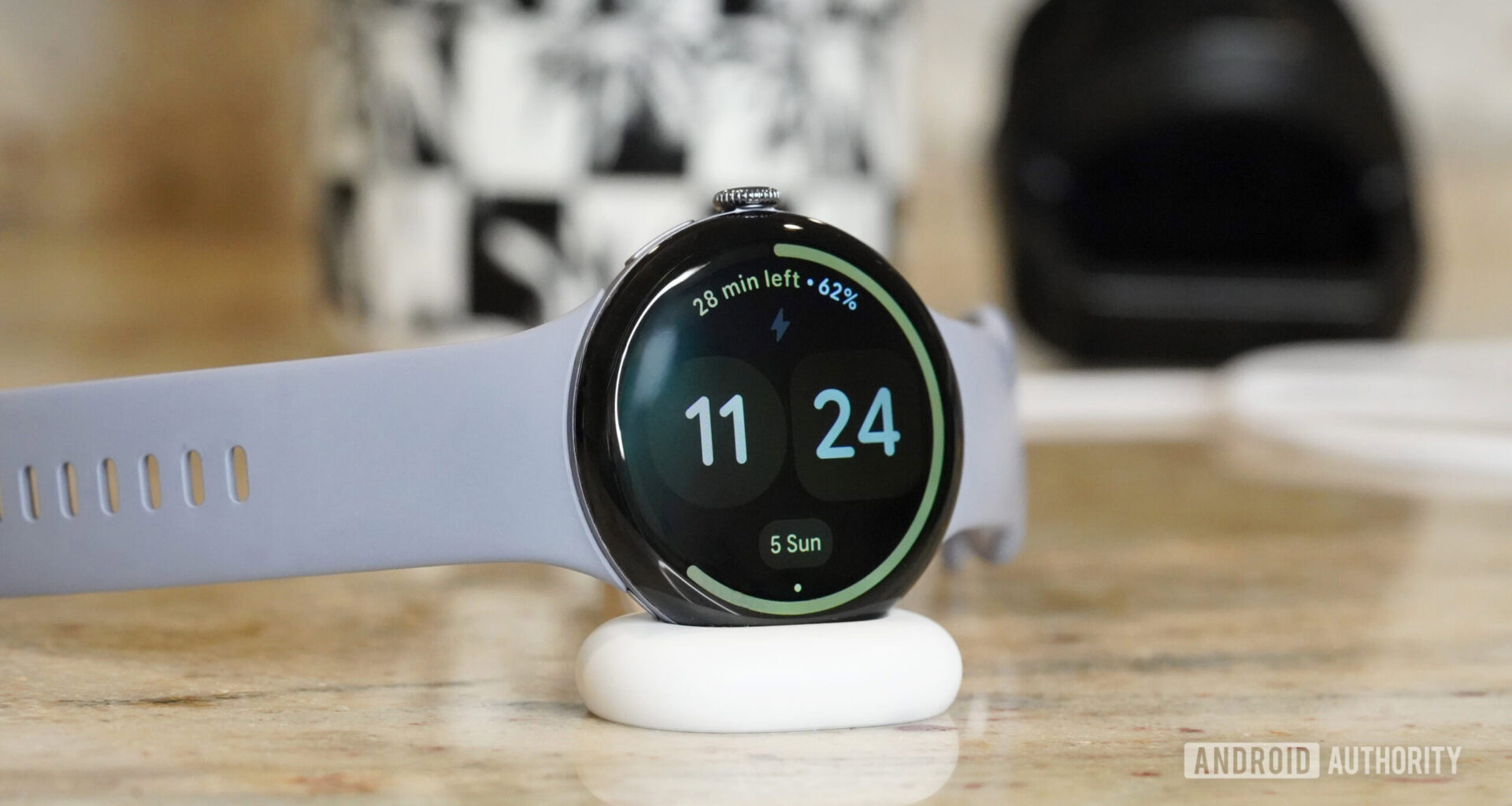 A Pixel Watch 4 charges on the line's newest dock design.