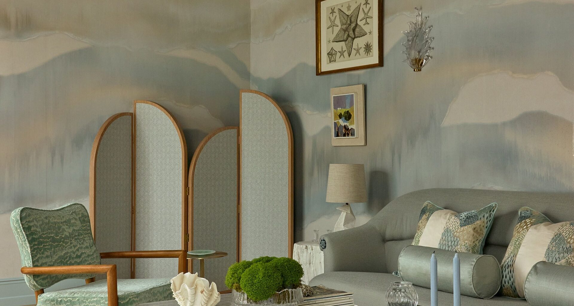 a soft blue, green and grey colored living room at wowhouse 2026