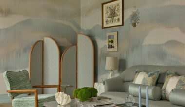 a soft blue, green and grey colored living room at wowhouse 2026