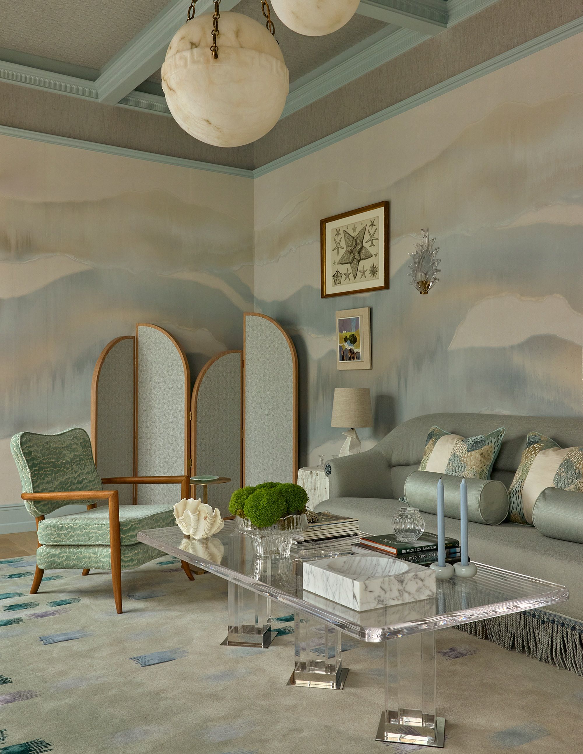 a soft blue, green and grey colored living room at wowhouse 2026