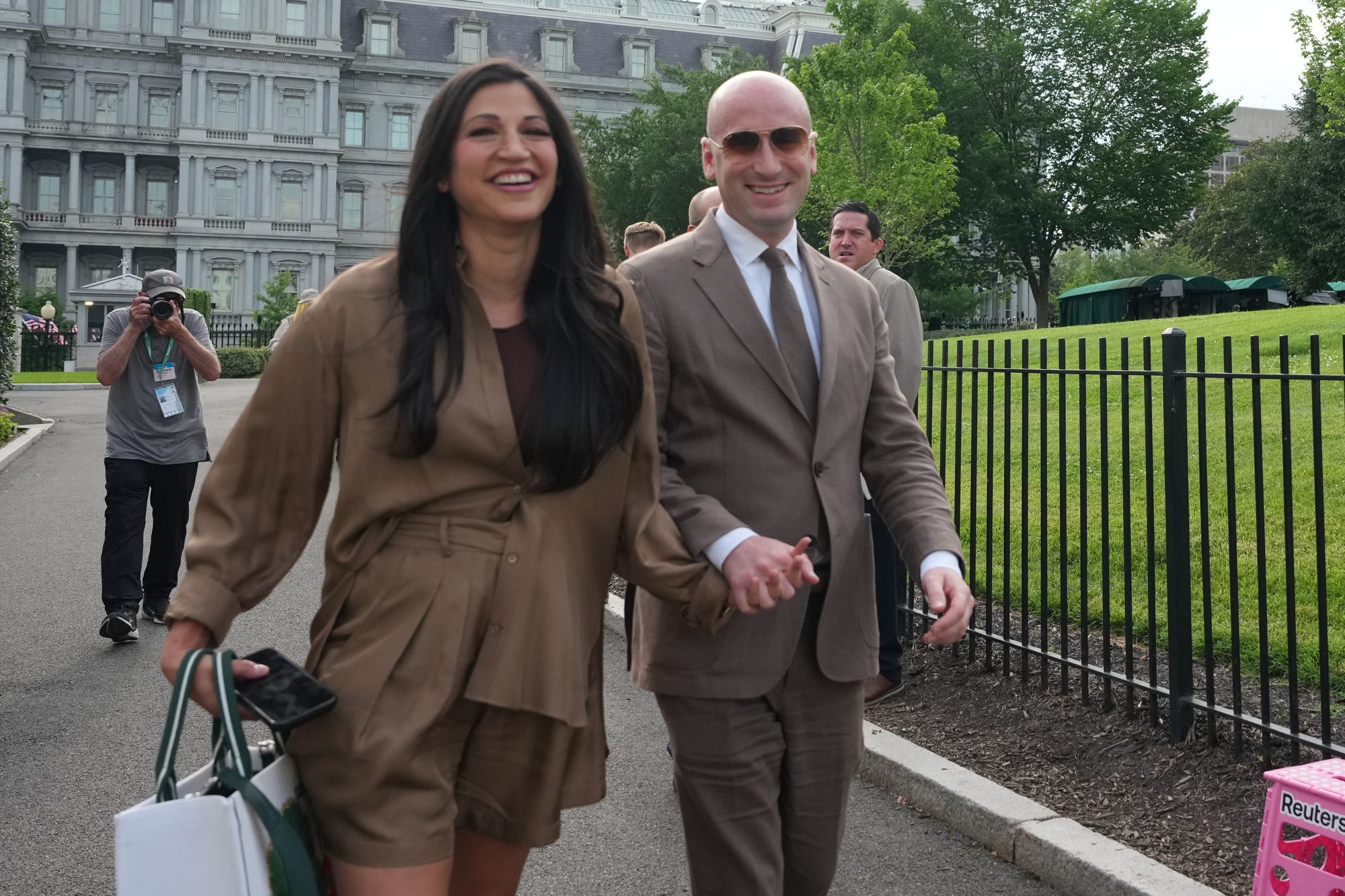White House deputy chief of staff Stephen Miller and his wife, Katie Miller, smiled as they arrived at the White House