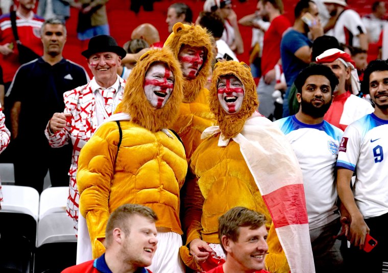 England fans dressed as three lions in the stands at the end of the FIFA World Cup Round of Sixteen match at the Al-Bayt Stadium in Al Khor, Qatar. Picture date: Sunday December 4, 2022. PA Photo. See PA story WORLDCUP England. Photo credit should read: Martin Rickett/PA Wire. RESTRICTIONS: Use subject to restrictions. Editorial use only, no commercial use without prior consent from rights holder.