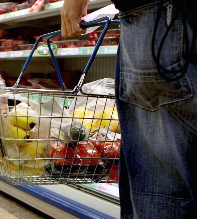 Undated file photo of a person holding a shopping basket in a supermarket. Trust in the grocery sector has plummeted to its lowest point in more than a decade as the majority of households grapple with supermarket prices, a survey suggests. Issue date: Tuesday August 29, 2023. PA Photo. See PA story CONSUMER Supermarkets. Photo credit should read: Julien Behal/PA Wire