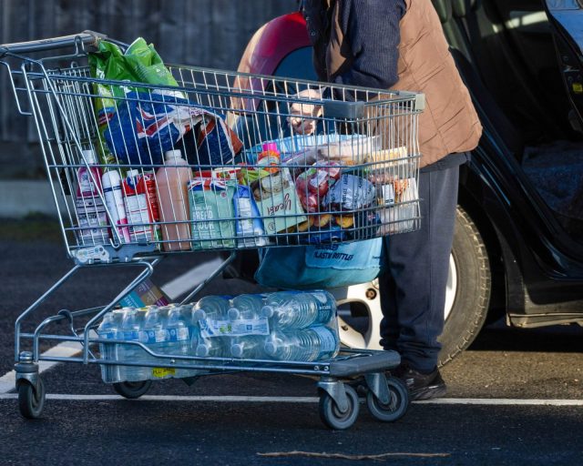 A customer places shopping bags in her car outside an Aldi Stores Ltd. supermarket in Benfleet, UK, on Tuesday, Nov. 26, 2024. UK grocery price inflation edged up in October as British shoppers flocked to supermarkets in the busiest month since the pandemic. Photographer: Chris Ratcliffe/Bloomberg via Getty Images