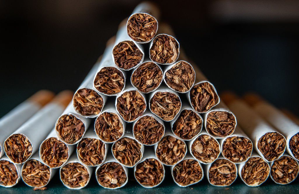 BATH, UNITED KINGDOM - NOVEMBER 10: In this photo illustration, cigarettes are arranged on a table in a pub beer garden on November 10, 2024 in Bath, England. Plans to ban smoking in pub gardens has been dropped from government plans but plans to make it illegal to smoke in children's playgrounds and outside schools and hospitals are still being considered. However the main focus of the updated Tobacco and Vapes Bill to create a smoke free UK generation by making it illegal for anyone currently aged 15 or under to ever buy cigarettes will remain. (Photo by Matt Cardy/Getty Images)
