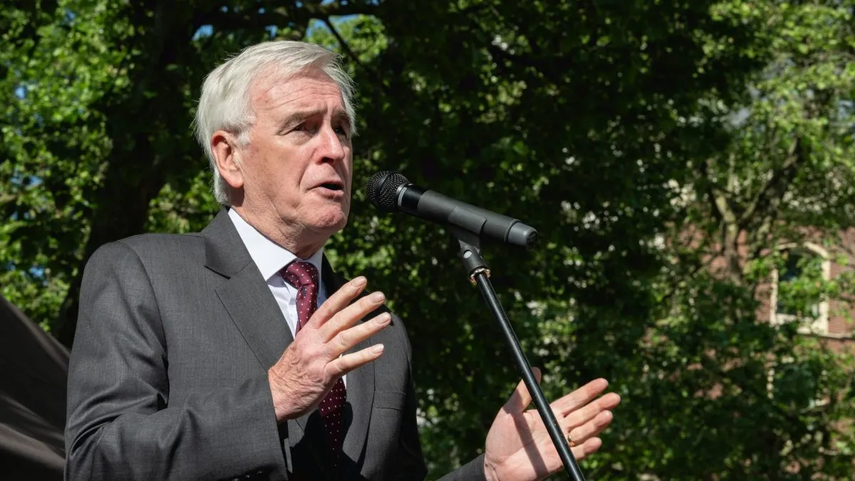 LONDON, ENGLAND - MAY 20: John McDonnell MP addresses supporters of Julian Assange gathering outside the Royal Courts of Justice on May 20, 2024 in London, England. Julian Assange has been held at London's Belmarsh Prison for five years of imprisonment without being convicted. The WikiLeaks founder is facing life imprisonment in the U.S. for publishing thousands of classified military and diplomatic documents in 2010, which U.S. Army whistleblower Chelsea Manning provided. (Photo by Guy Smallman/Getty Images)