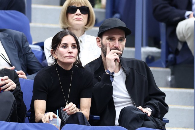 US actress Courteney Cox (L) and Irish singer-songwriter Johnny McDaid at the US Open