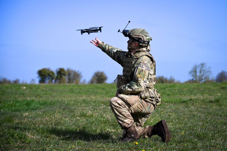 WARMINSTER, ENGLAND - MARCH 30: Soldiers from 16 Air Assault Brigade (16 Air Asslt Bde) set up and fly their military drones after jumping from a Royal Air Force (RAF) A400M transport aircraft onto Salisbury Plain at Copehill Down training facility on March 30, 2026 near Warminster, England. Around 270 soldiers from 16 Air Assault Brigade are carrying out a 