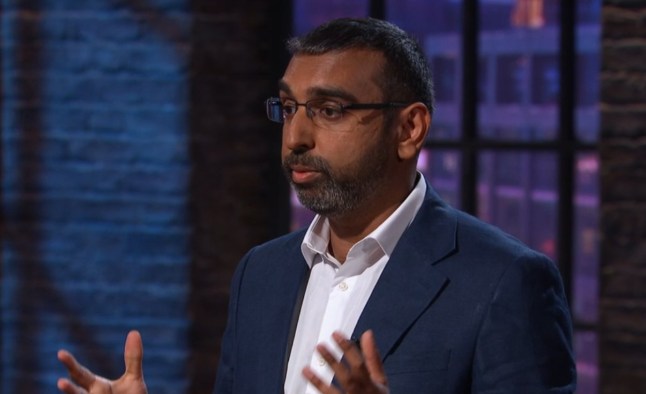 Jinesh Vohra stands in the den.