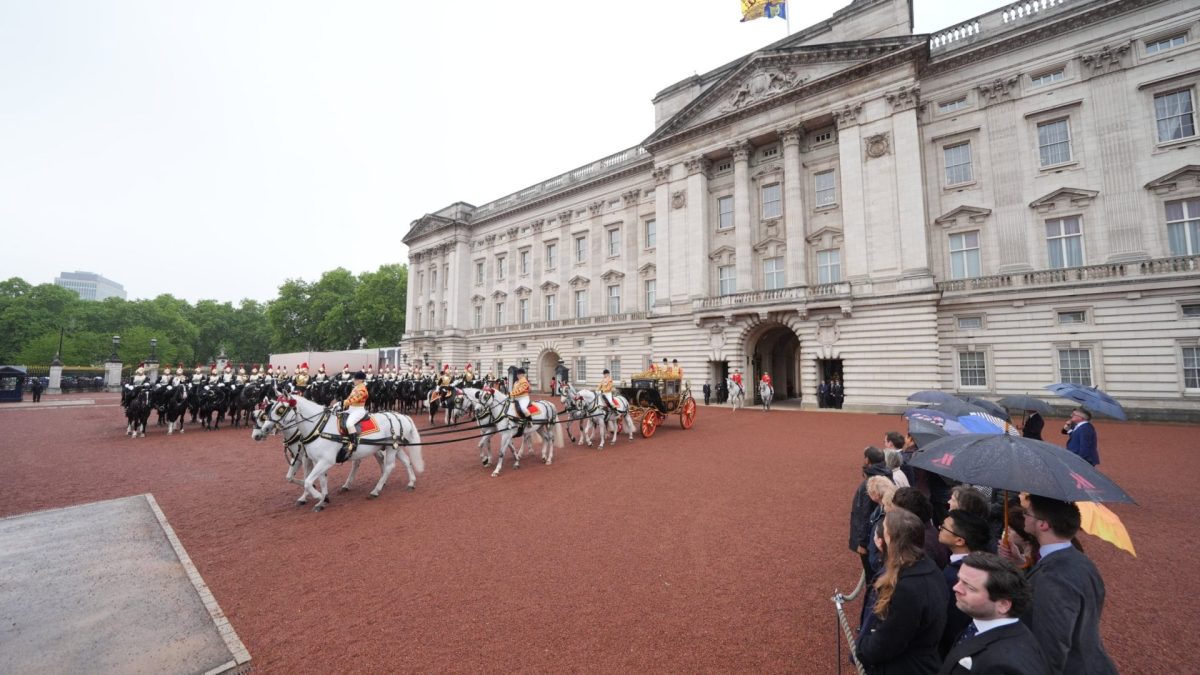 King Charles III and Queen Camilla travel in the Irish State Coach as they depart Buckingham Palace, London, to attend the State Opening of Parliament in the House of Lords at the Palace of Westminster, London. Picture date: Wednesday May 13, 2026. PA Photo. Photo credit should read: Yui Mok/PA Wire