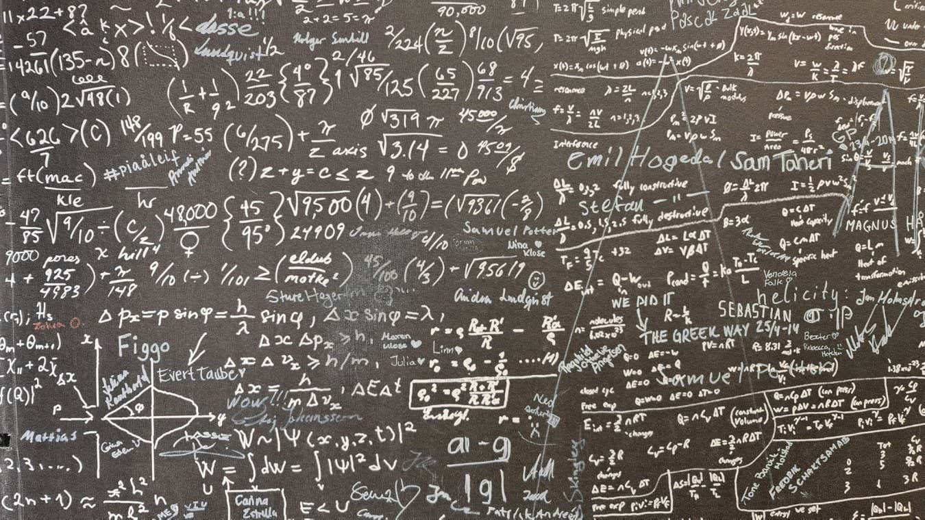 Blackboard with mathematical equations written on it