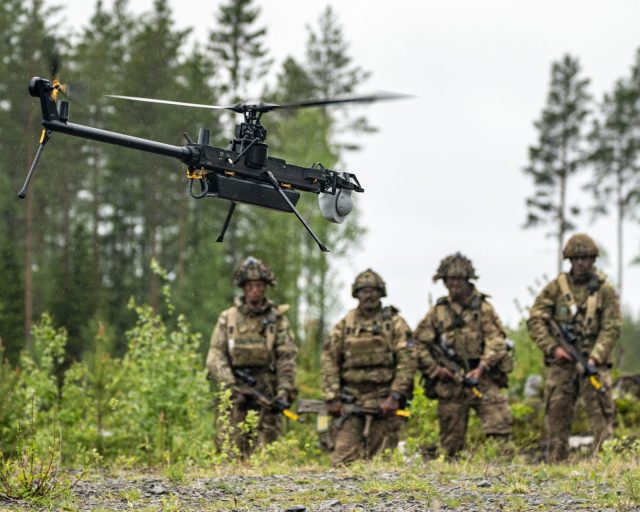 British Army soldiers from 3 Rifles watch a single-rotor helicopter style Ghost drone, which operates via global mobile networks and can be remotely piloted from anywhere in the world with extreme portability and uses AI software to help soldiers let the drone autonomously identify, classify, and track objects of interest in a battle. The all-weather resilient Ghost drone is being used to keep eyes on the battlefield at an undisclosed training ground less than 50 kilometres from the Russian border in Finland where NATO troops are taking part in Ex NORTHERN STAR, led by the Finnish military, where coalition soldiers from work alongside their NATO allies and train in combat to deter aggressive neighbouring states. The large scale ground exercise, comprising of around 4,000 coalition troops include the use of these new technologies, including both the Ghost reconnaissance and Bolt attack drones alongside newly adopted Android Team Awareness Kit (ATAK), which is a phone-sized electronic screen displaying GPS and geospatial mapping with real-time locations of troops, allowing commanders to see the entire battle picture instantly, locating friendly forces and striking enemy targets. Picture date: Monday May 25, 2026. PA Photo. Photo credit should read: Ben Birchall/PA Wire