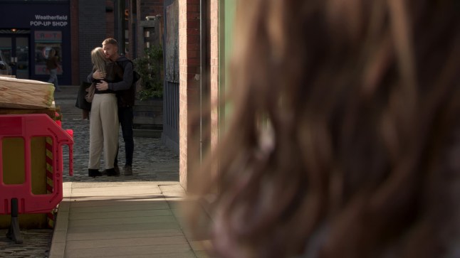 Maria spying on Gary and Sarah hugging on Coronation Street