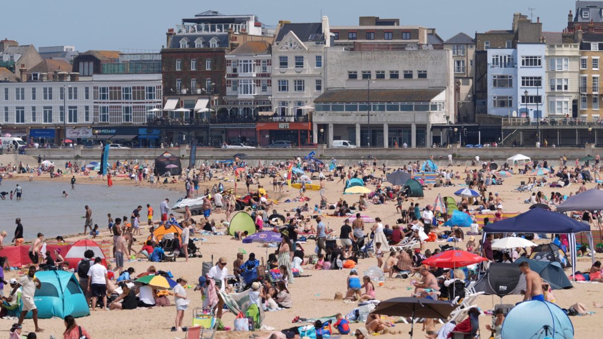People enjoy the warm weather on the beach in Margate, Kent. Cloudy skies and downpours are expected for many this weekend as a record-breaking heatwave gives way to cooler weather ahead of a likely soggy start to June. While some will enjoy a continuation of the warm weather and sunshine this weekend, others will be hit with heavy rain before temperatures drop for most next week. Picture date: Saturday May 30, 2026. PA Photo. Photo credit should read: Gareth Fuller/PA Wire